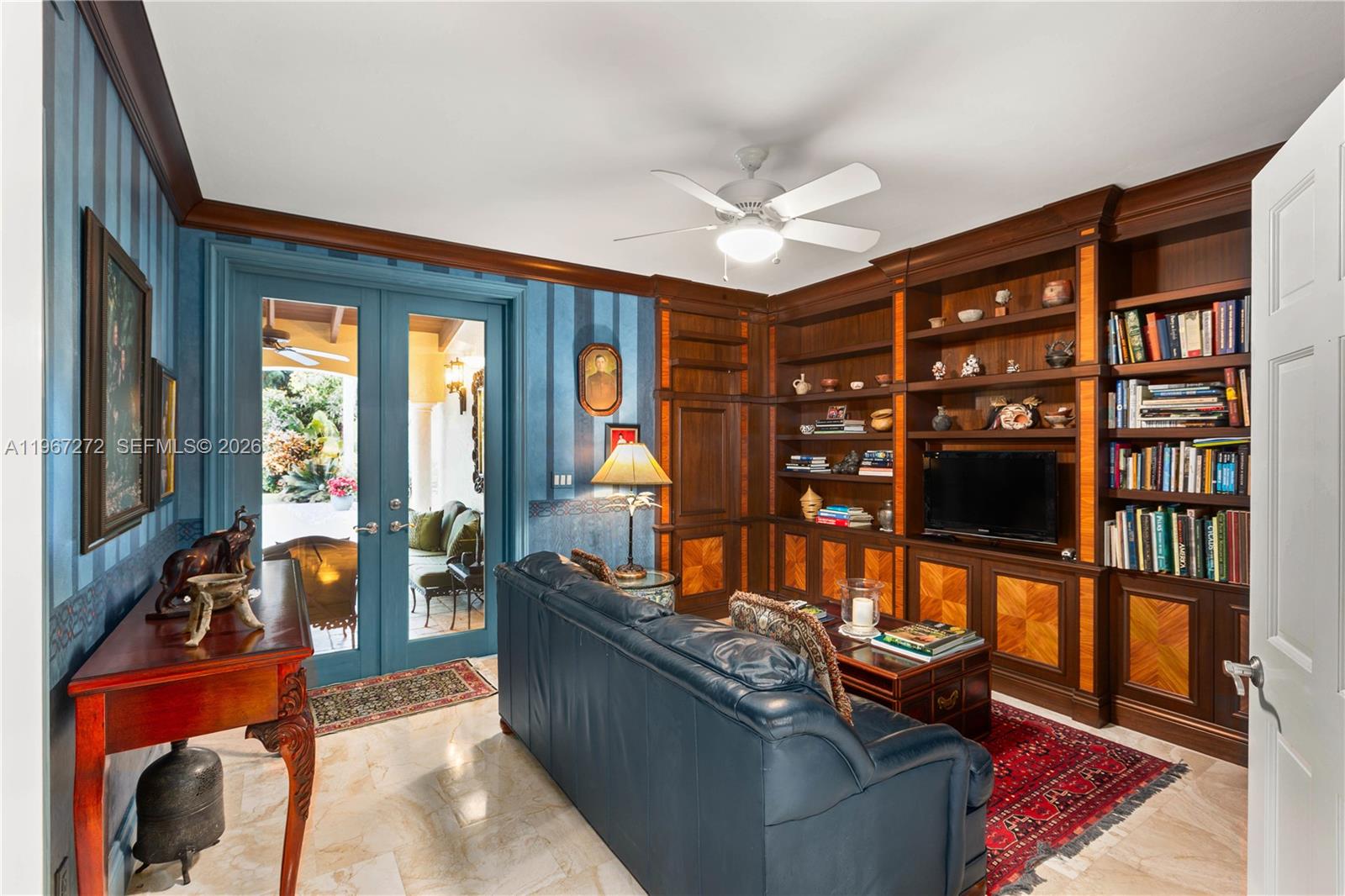 4867 Southwest 82nd Street Miami, FL 33143 - Photo 42 of 69 a living room with furniture and a flat screen tv