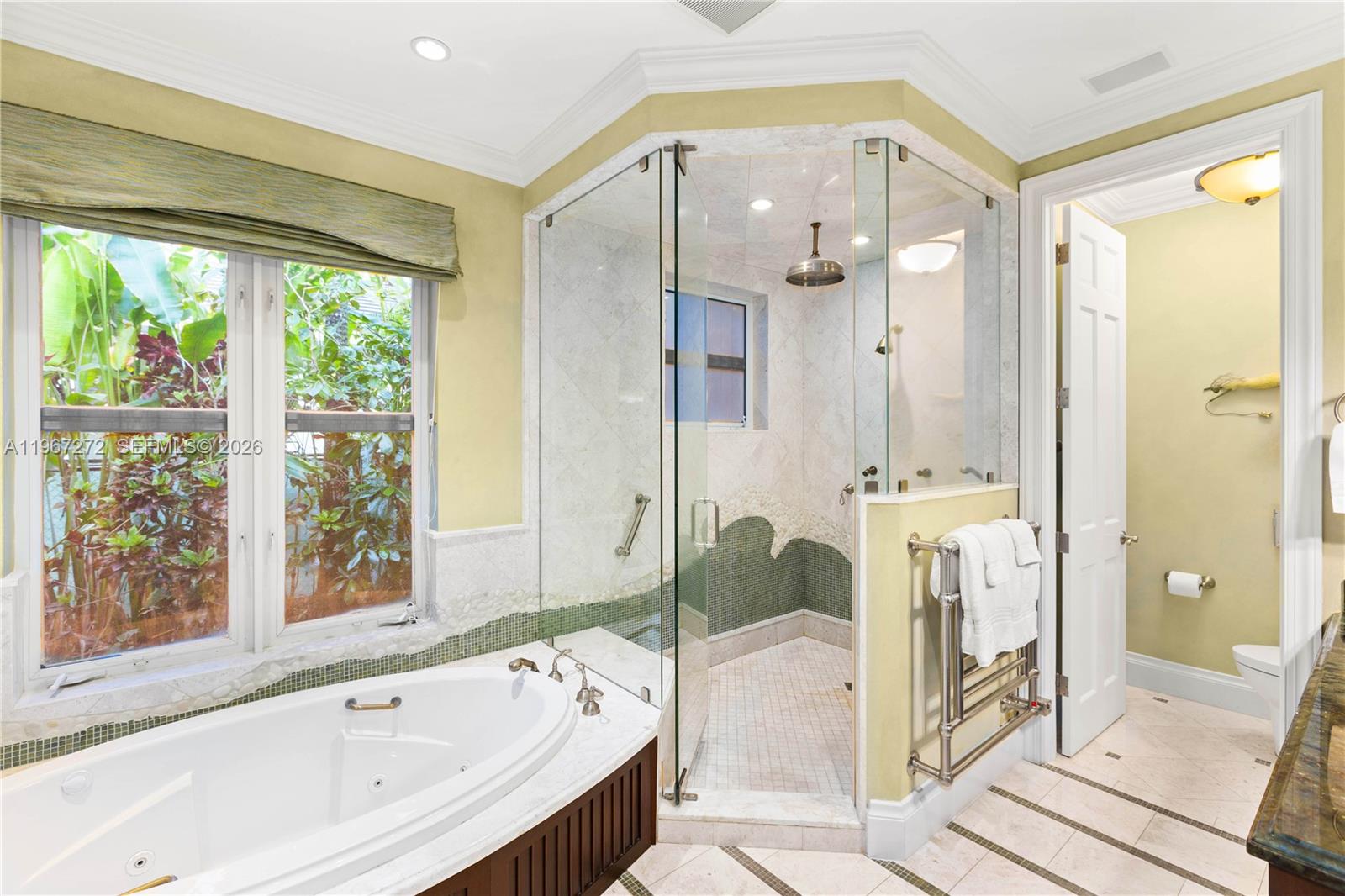 4867 Southwest 82nd Street Miami, FL 33143 - Photo 50 of 69 a spacious bathroom with a tub shower and mirror