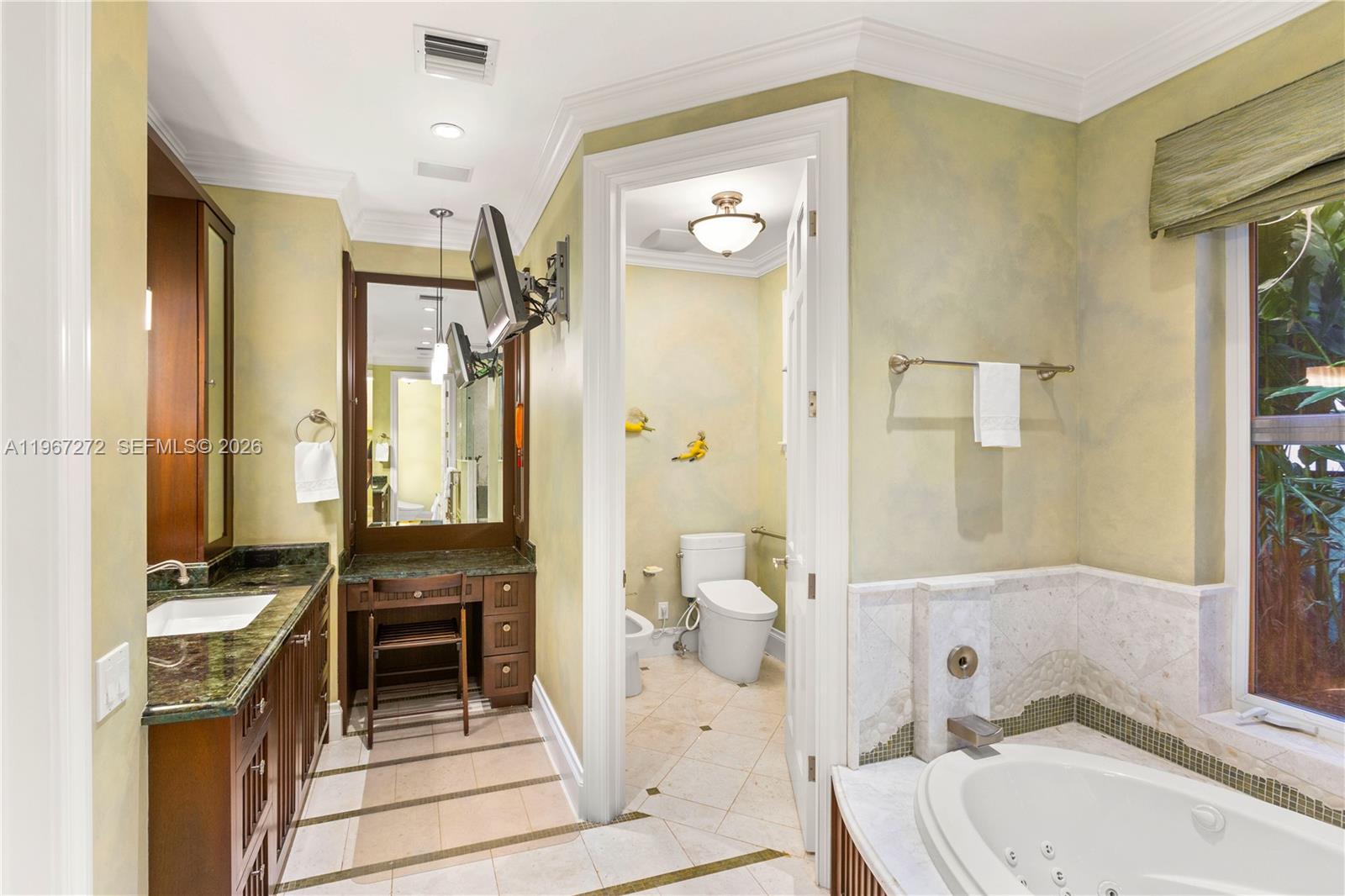 4867 Southwest 82nd Street Miami, FL 33143 - Photo 53 of 69 a bathroom with a sink a toilet and shower