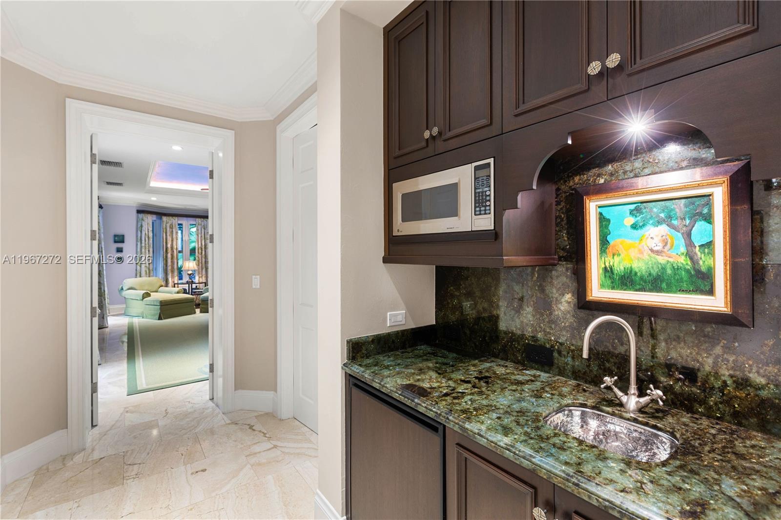 4867 Southwest 82nd Street Miami, FL 33143 - Photo 55 of 69 a kitchen with stainless steel appliances granite countertop a stove and cabinets