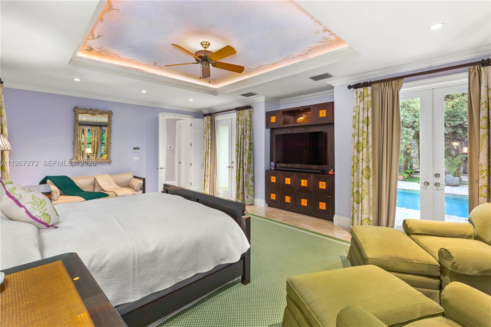 4867 Southwest 82nd Street Miami, FL 33143 - Photo 57 of 69 a bedroom with a bed window and a chandelier