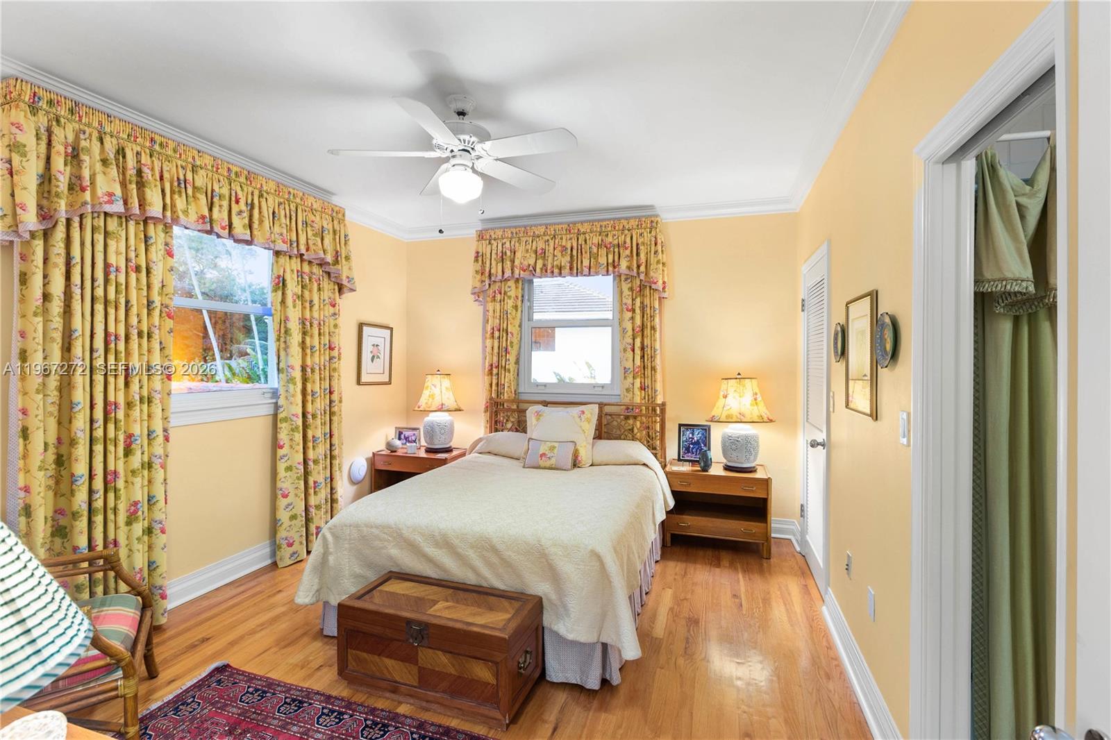 4867 Southwest 82nd Street Miami, FL 33143 - Photo 62 of 69 a bedroom with a bed and a chandelier