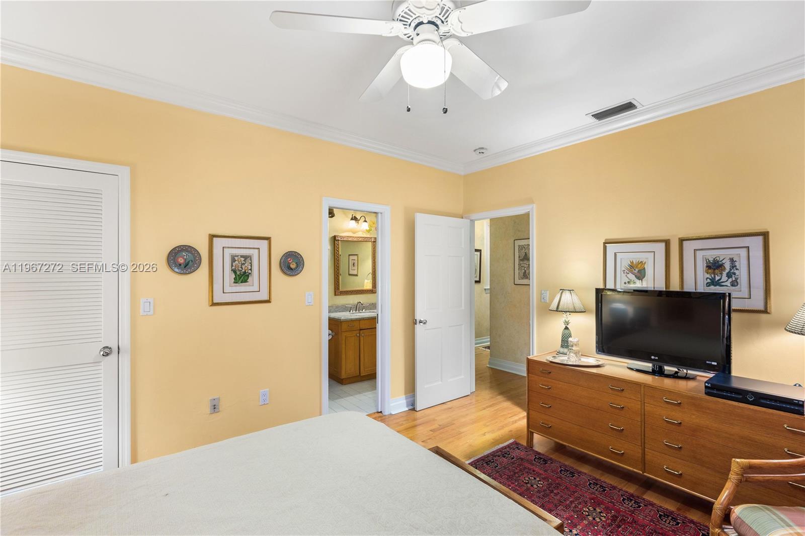 4867 Southwest 82nd Street Miami, FL 33143 - Photo 63 of 69 a bedroom with a bed and a flat screen tv