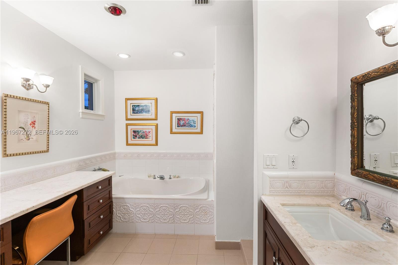 4867 Southwest 82nd Street Miami, FL 33143 - Photo 65 of 69 a spacious bathroom with a tub sink and mirror