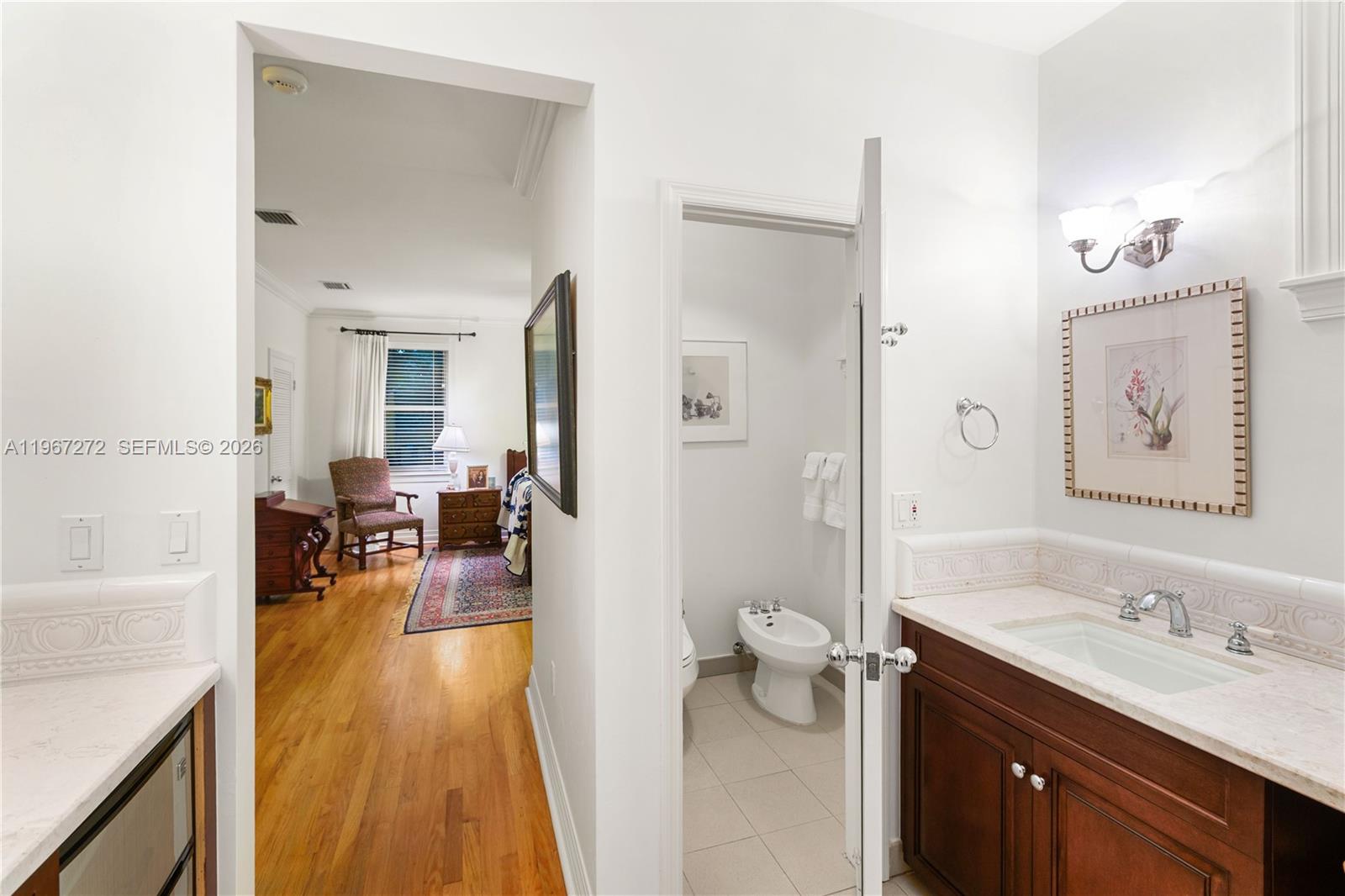 4867 Southwest 82nd Street Miami, FL 33143 - Photo 66 of 69 a spacious bathroom with a granite countertop sink a toilet a mirror and shower