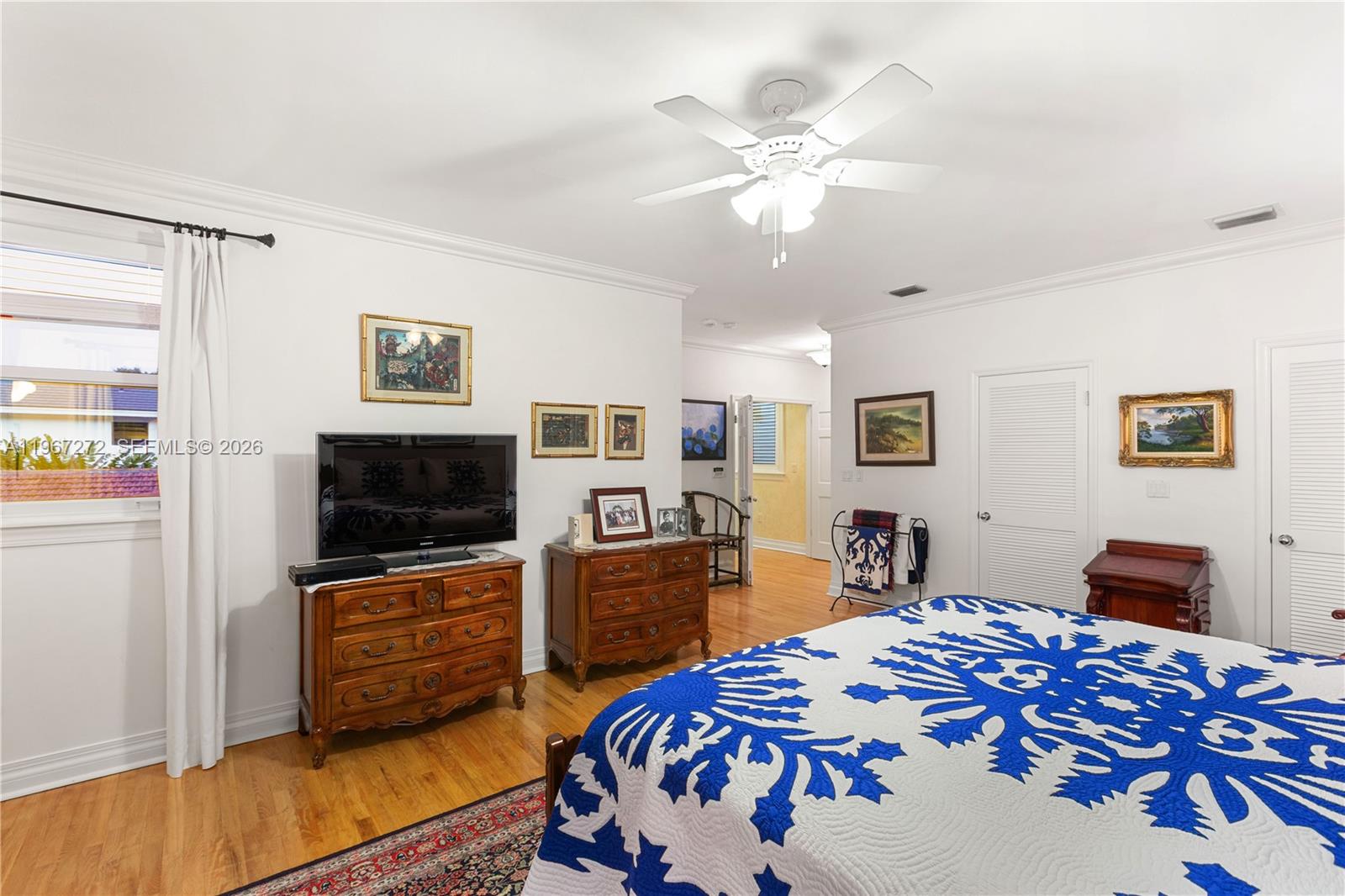 4867 Southwest 82nd Street Miami, FL 33143 - Photo 67 of 69 a bedroom with a bed and furniture