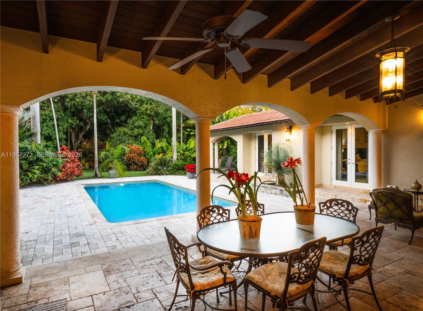 4867 Southwest 82nd Street Miami, FL 33143 - Photo 8 of 69 a patio with a table and chairs