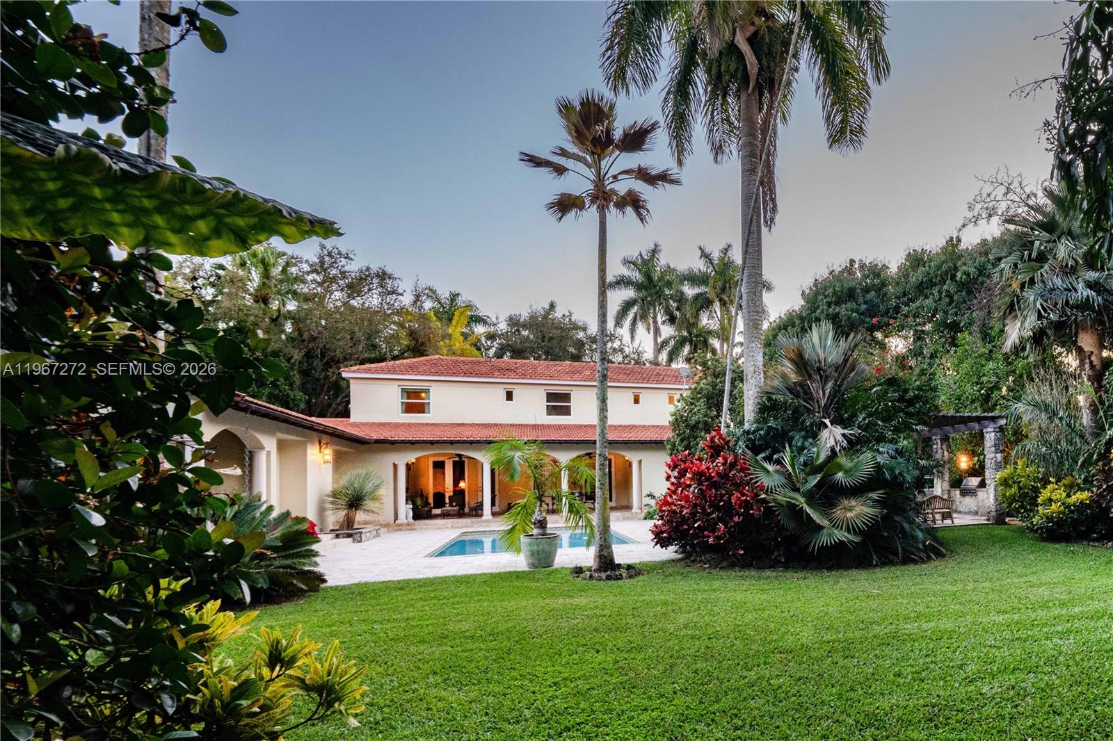 4867 Southwest 82nd Street Miami, FL 33143 - Photo 10 of 69 a view of a house with a yard and potted plants