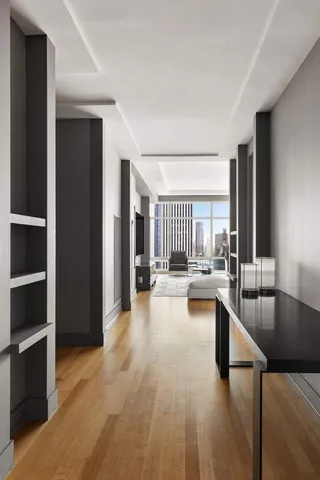 a view of a living room kitchen and a sink