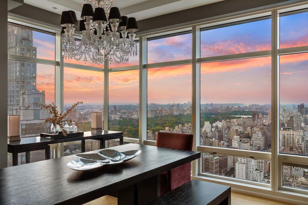 151 East 58th Street, Unit 35A Manhattan, NY 10022 - Photo 14 of 18 a view of a dining room with furniture window and outside view