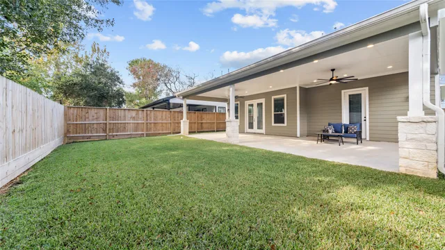 a view of a house with a backyard