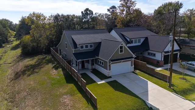 a view of a house with pool and deck