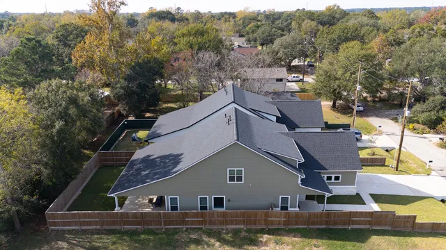 an aerial view of a house with a ocean view