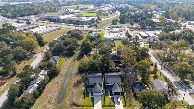 an aerial view of residential houses with outdoor space