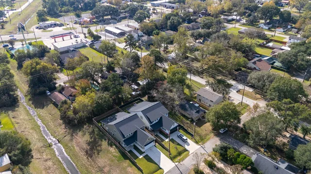 a aerial view of a house with pool and deck