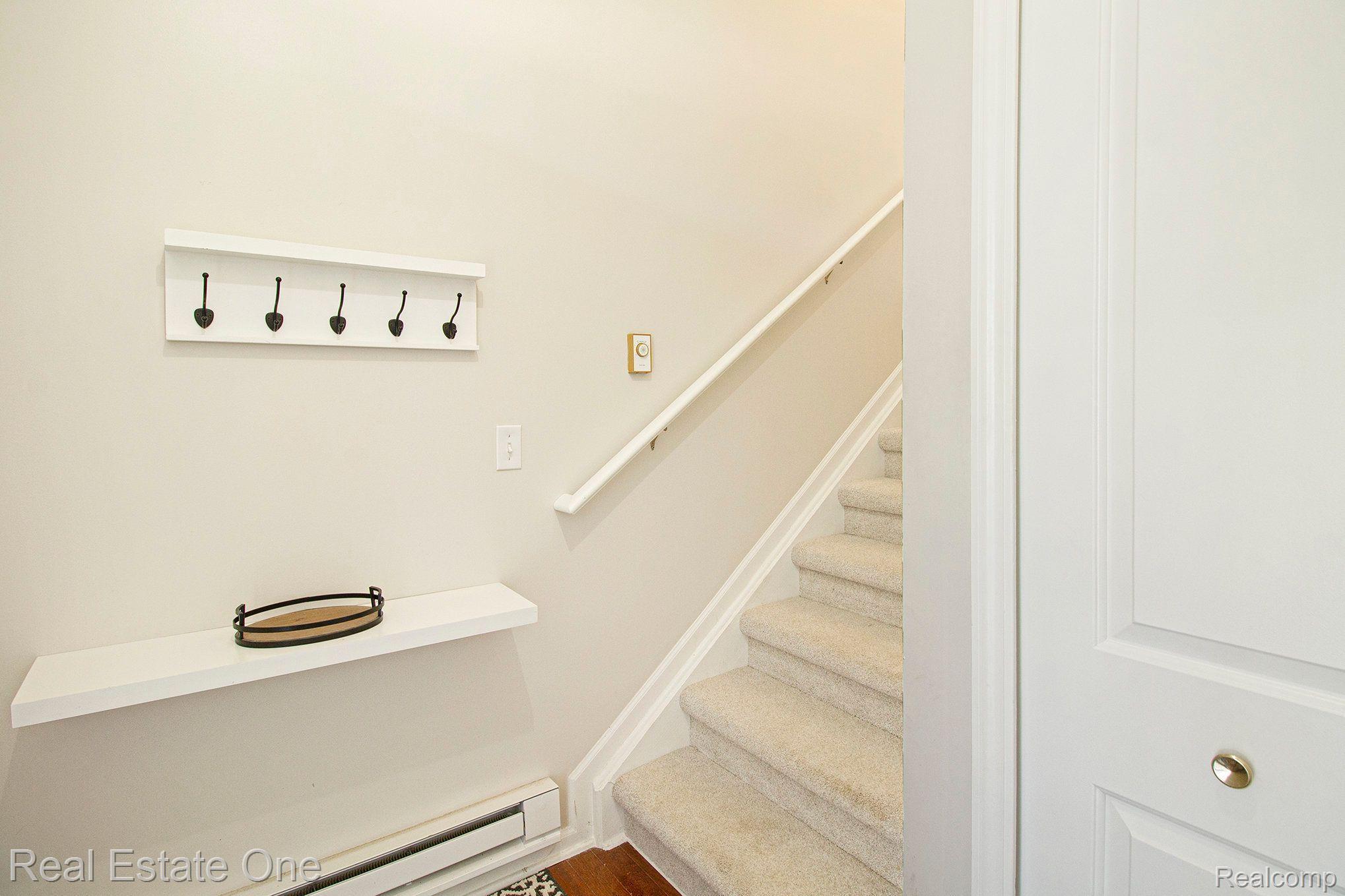 4268 Hampton Ridge Boulevard Howell, MI 48843 - Photo 4 of 24 STAIRS IN ENTRY FOYER