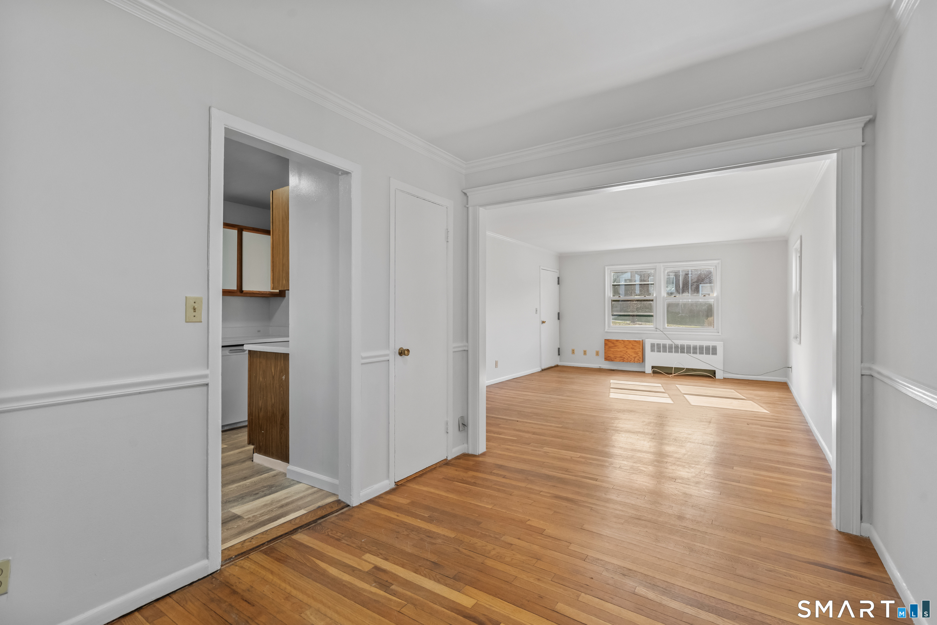 146 Blachley Road, Unit C Stamford, CT 06902 - Photo 2 of 44 a view of empty room with wooden floor and fan