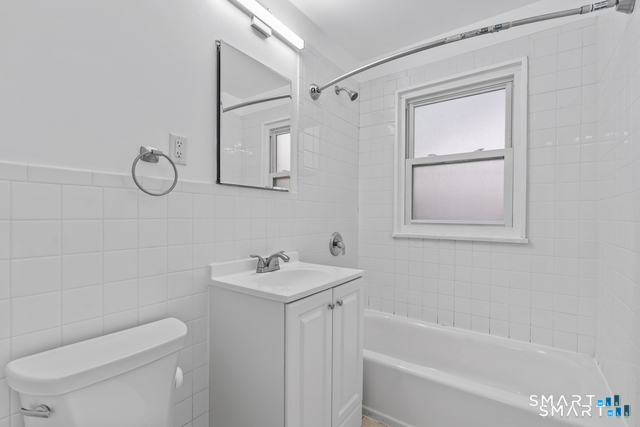 146 Blachley Road, Unit C Stamford, CT 06902 - Photo 23 of 44 a bathroom with a toilet sink and bathtub