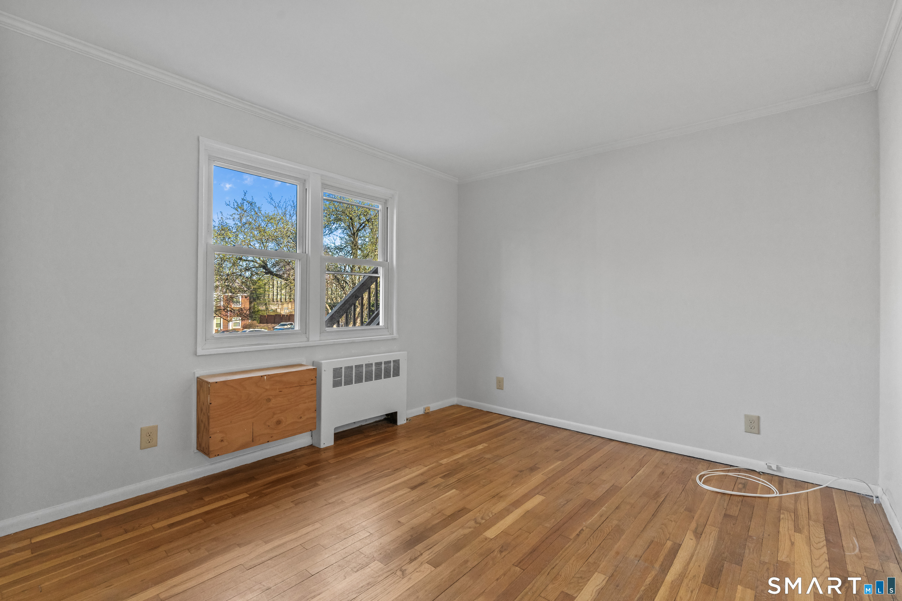 146 Blachley Road, Unit C Stamford, CT 06902 - Photo 24 of 44 wooden floor in an empty room with a window