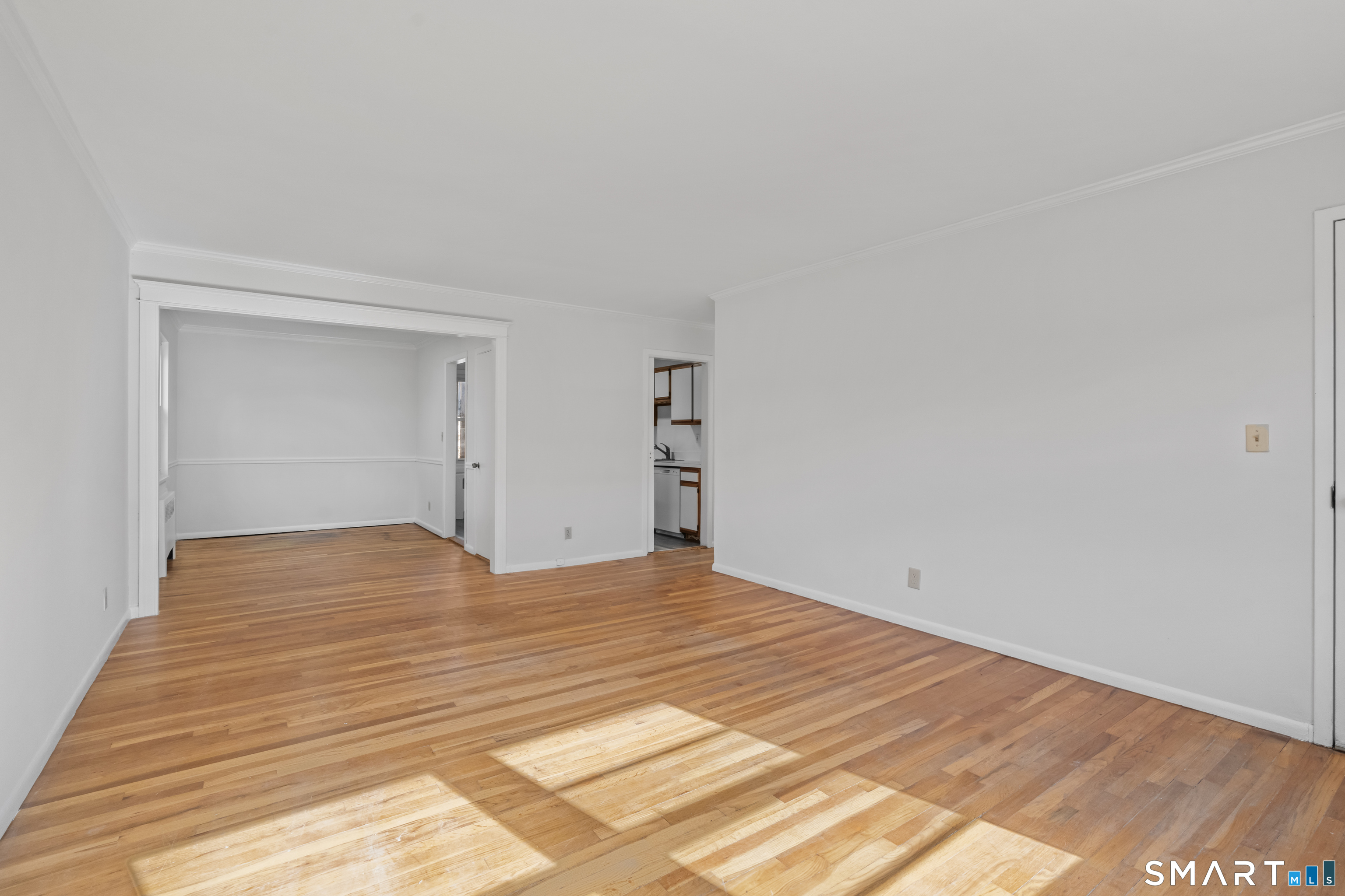 146 Blachley Road, Unit C Stamford, CT 06902 - Photo 4 of 44 a view of empty room with wooden floor