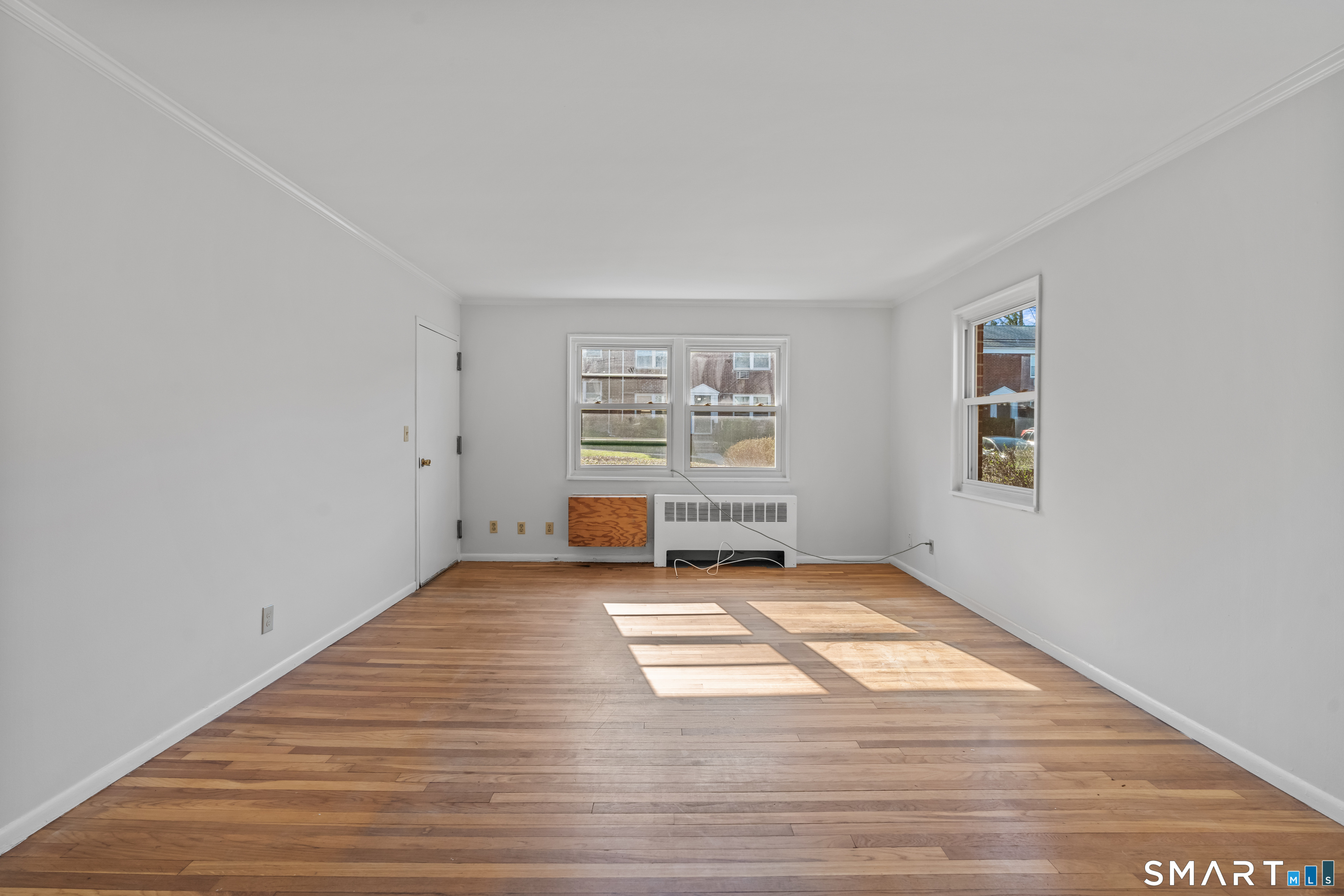 146 Blachley Road, Unit C Stamford, CT 06902 - Photo 8 of 44 a view of an empty room with a window