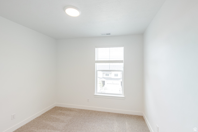 675 West 4500th South, Unit P301 Mapleton, UT 84664 - Photo 5 of 16 Neutral-toned carpeting paired with crisp white walls and baseboards
