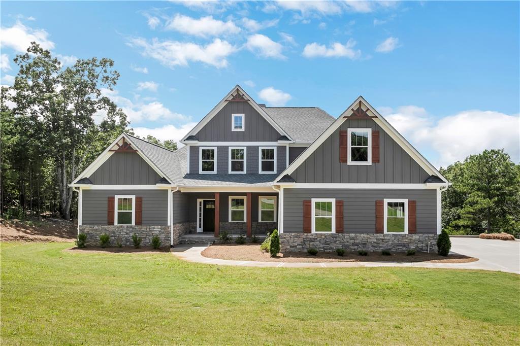 771 Stoneledge Road Jasper, GA 30143 - Photo 1 of 1 a front view of a house with a garden