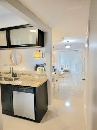 a bathroom with a sink a mirror and vanity