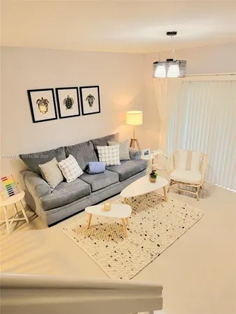 a living room with a bed and a couch