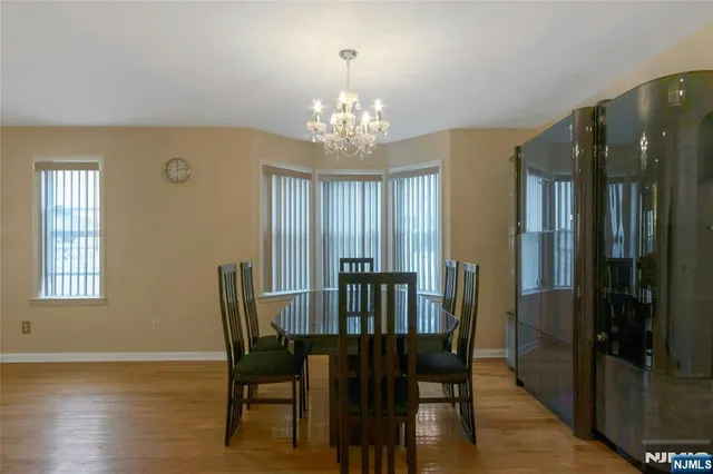 a view of a dining room with furniture and window