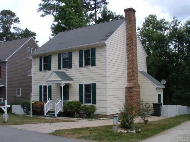 4641 Draper Road Raleigh, NC 27616 - Photo 1 of 9 a front view of a house with a yard and potted plants