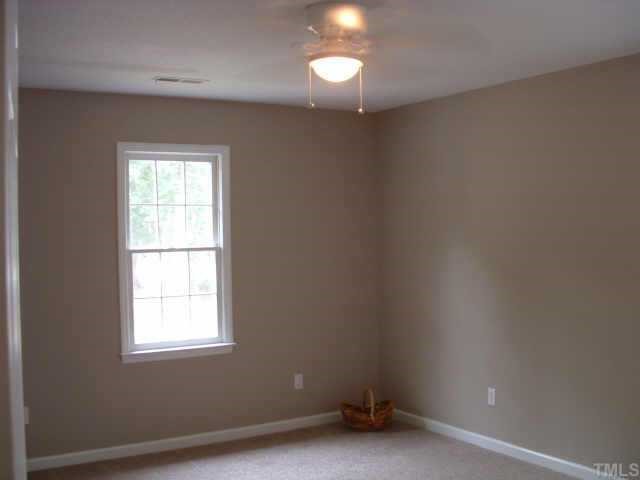 4641 Draper Road Raleigh, NC 27616 - Photo 7 of 9 an empty room with a window