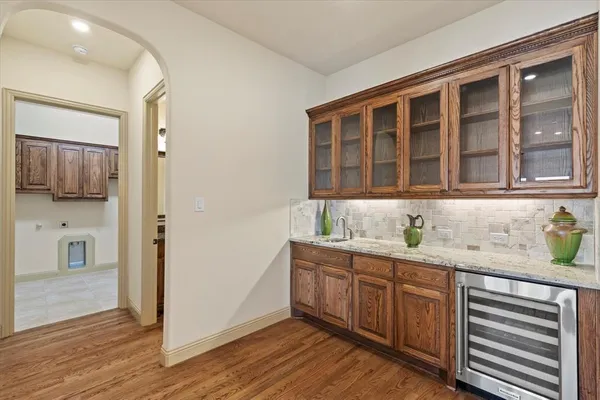a kitchen with granite countertop a sink and cabinets
