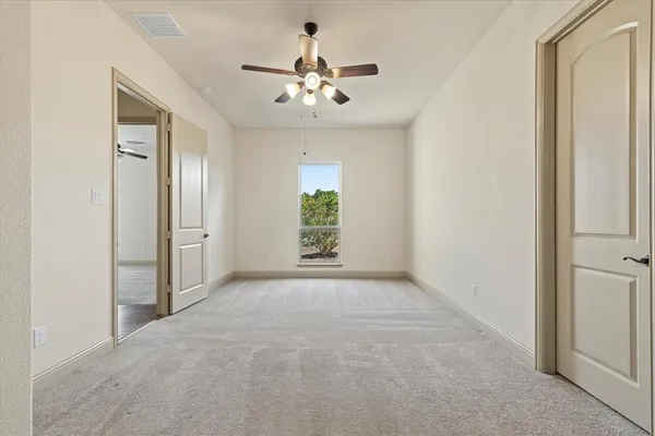 a view of an empty room with a window