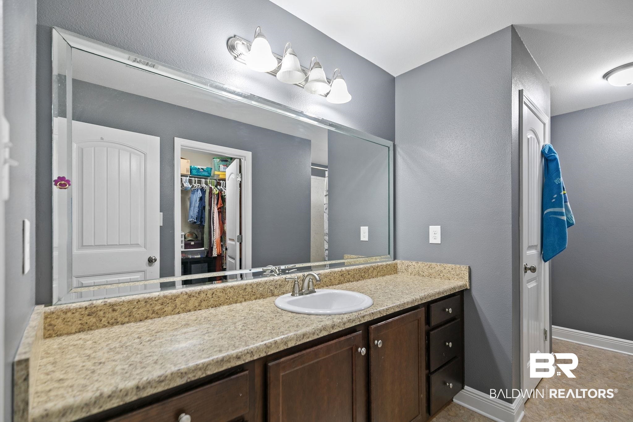 15573 Talus Court Foley, AL 36535 - Photo 24 of 50 Bathroom featuring vanity and tile patterned flooring