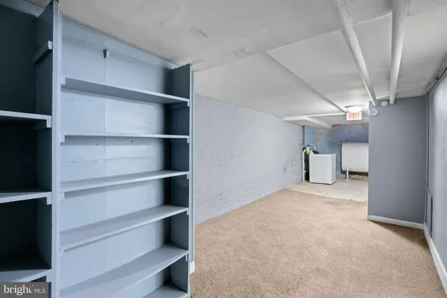 a view of an empty room with a closet