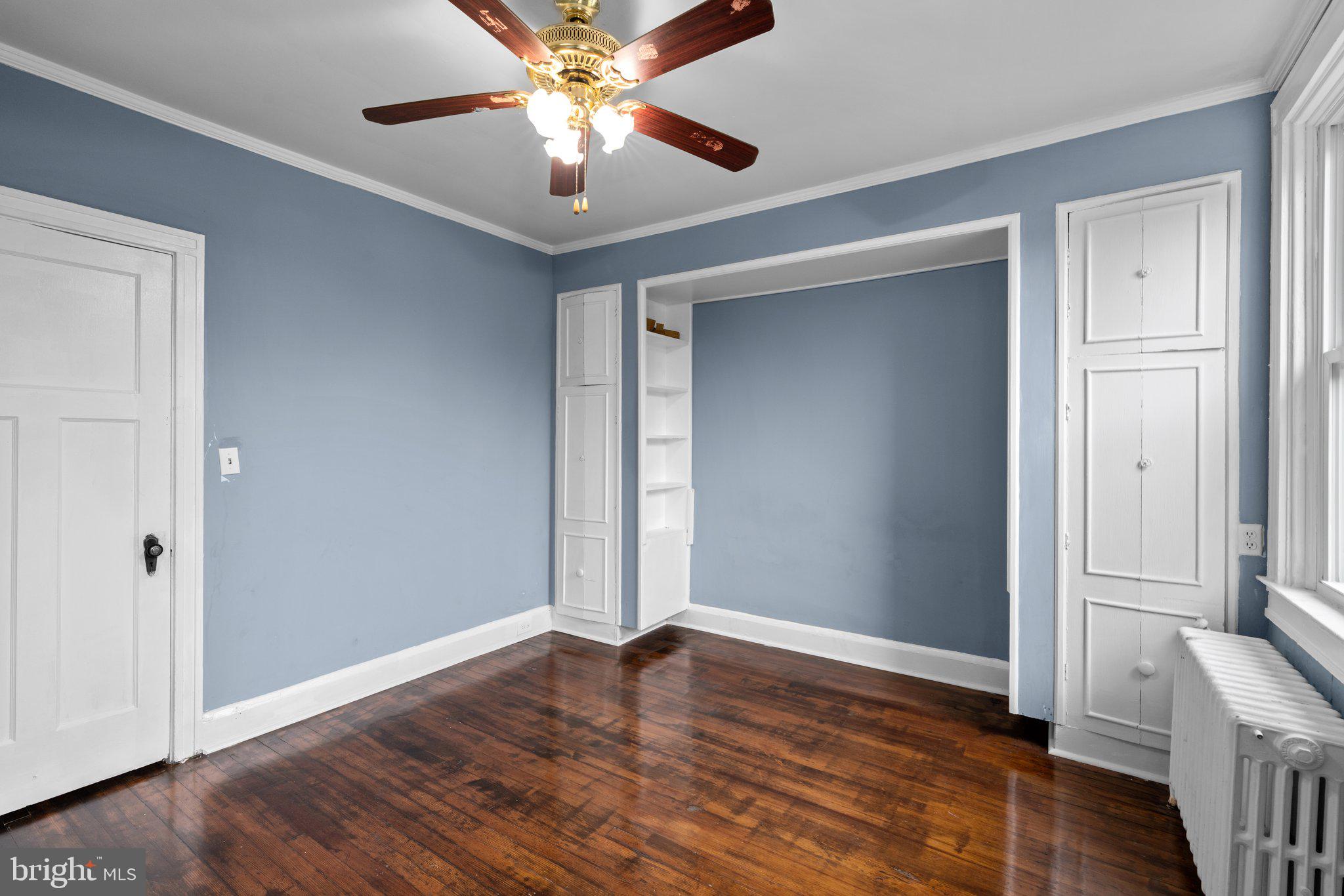 4208 Sheldon Avenue Baltimore, MD 21206 - Photo 2 of 26 a view of an empty room with wooden floor