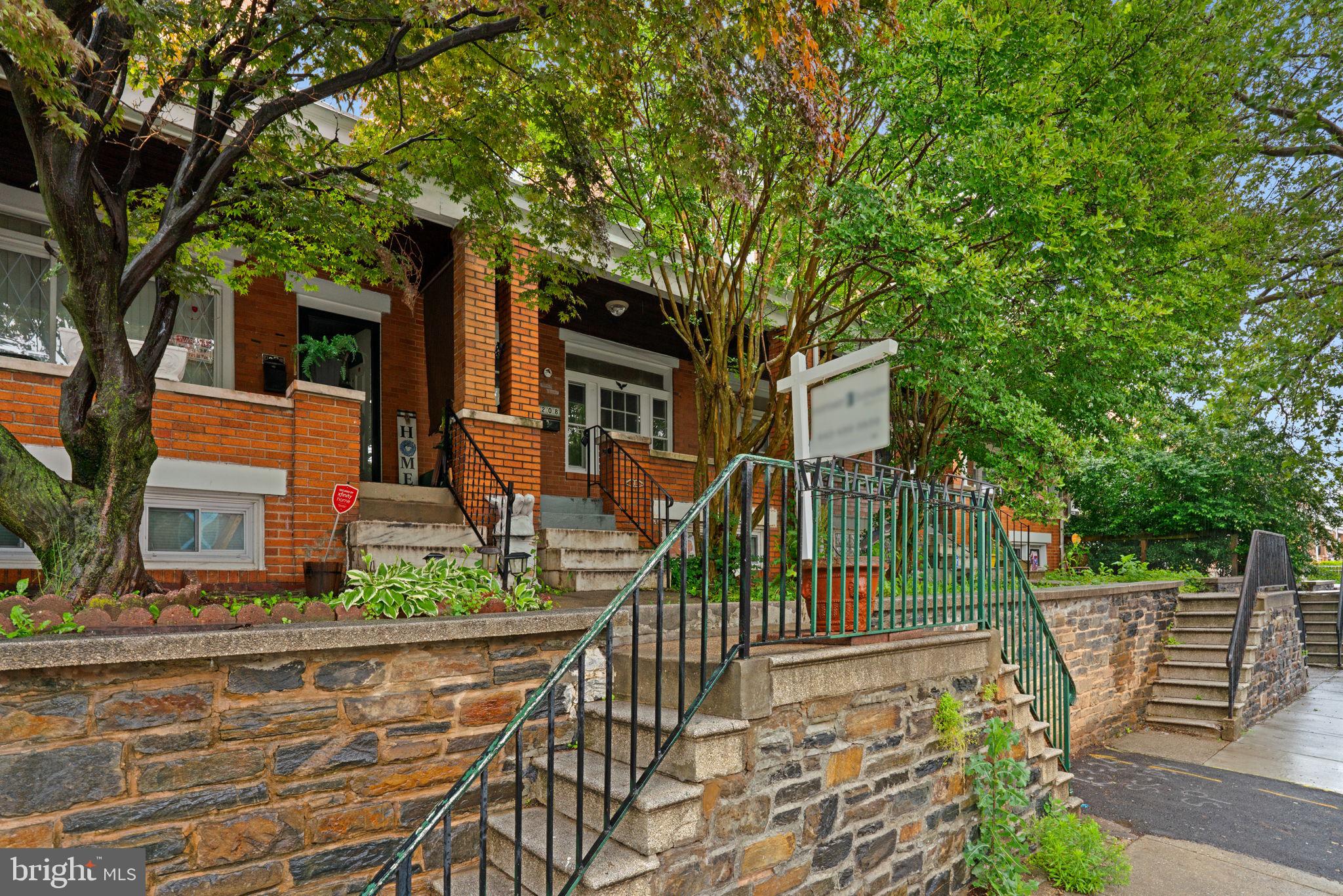 4208 Sheldon Avenue Baltimore, MD 21206 - Photo 21 of 26 front view of a house with a tree