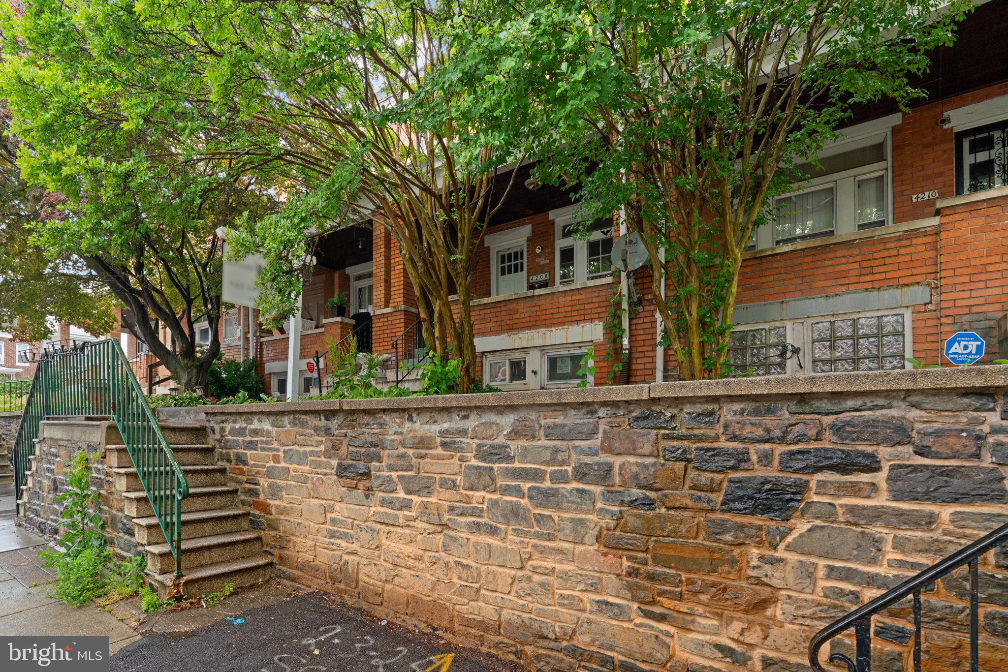 4208 Sheldon Avenue Baltimore, MD 21206 - Photo 22 of 26 a front view of a house with a garden