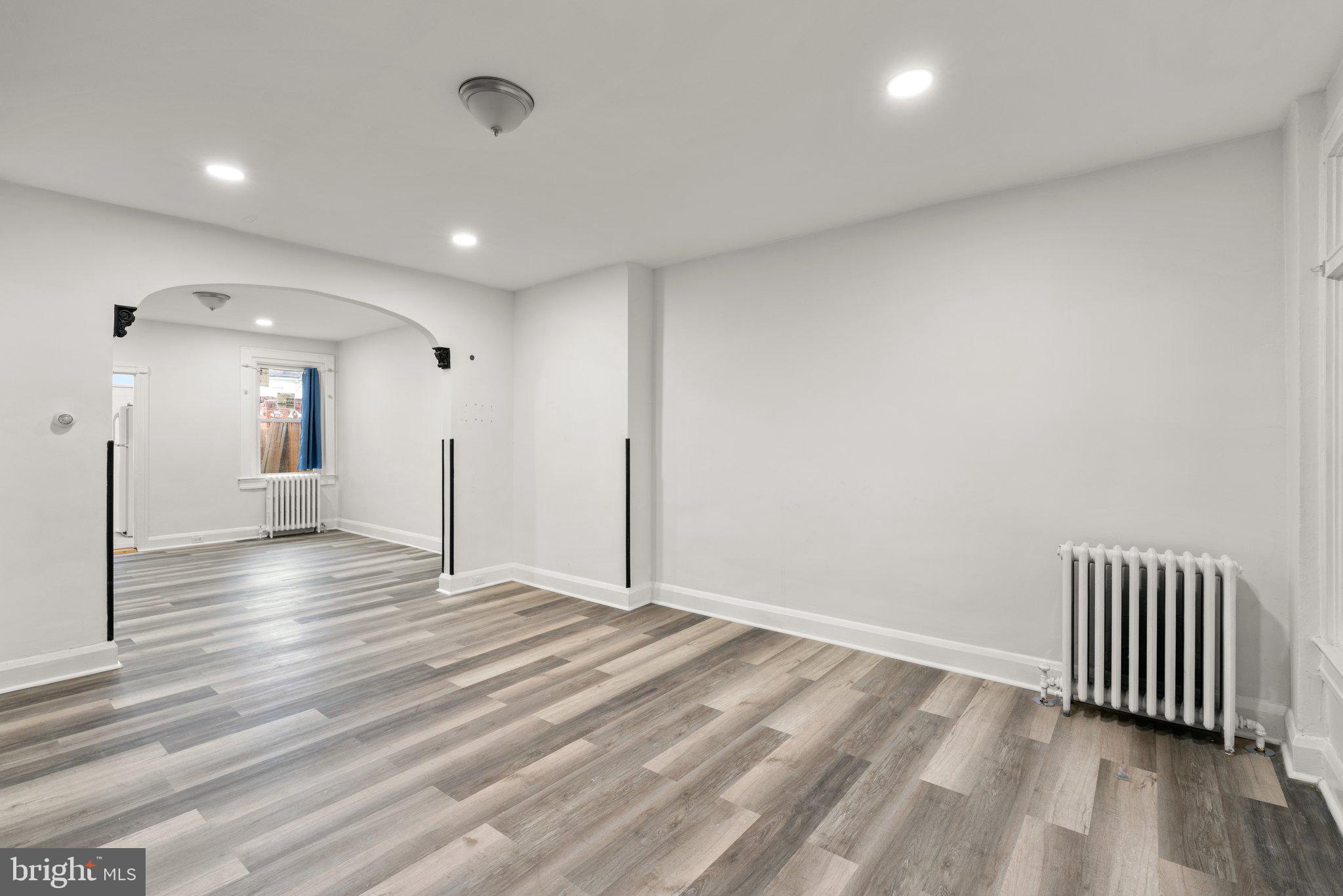 4208 Sheldon Avenue Baltimore, MD 21206 - Photo 26 of 26 wooden floor in an empty room with a window
