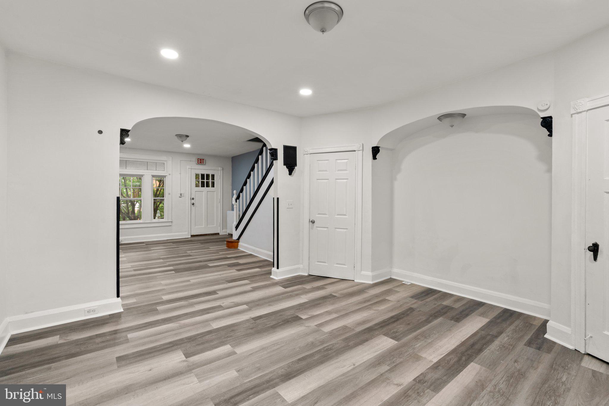 4208 Sheldon Avenue Baltimore, MD 21206 - Photo 8 of 26 a view of a hallway with wooden floor and staircase