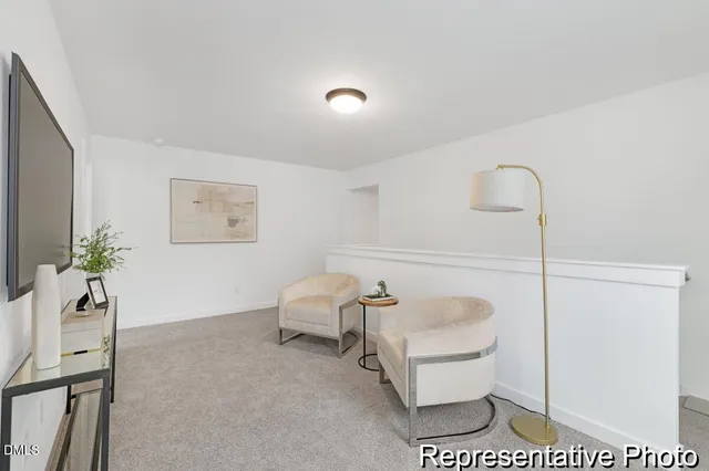 a spacious bedroom with a bed and a couch