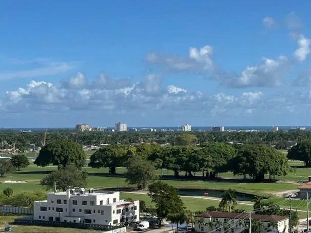 a view of a lake with houses in back