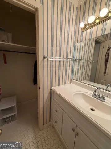 a bathroom with a sink a toilet and bathtub