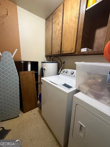 a view of a house with a big yard and potted plants