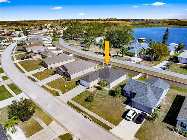 an aerial view of a house with a swimming pool