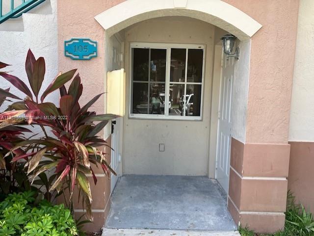 2910 Southeast 13th Road, Unit 10544 Homestead, FL 33035 - Photo 1 of 7 a view of a house with a potted plant