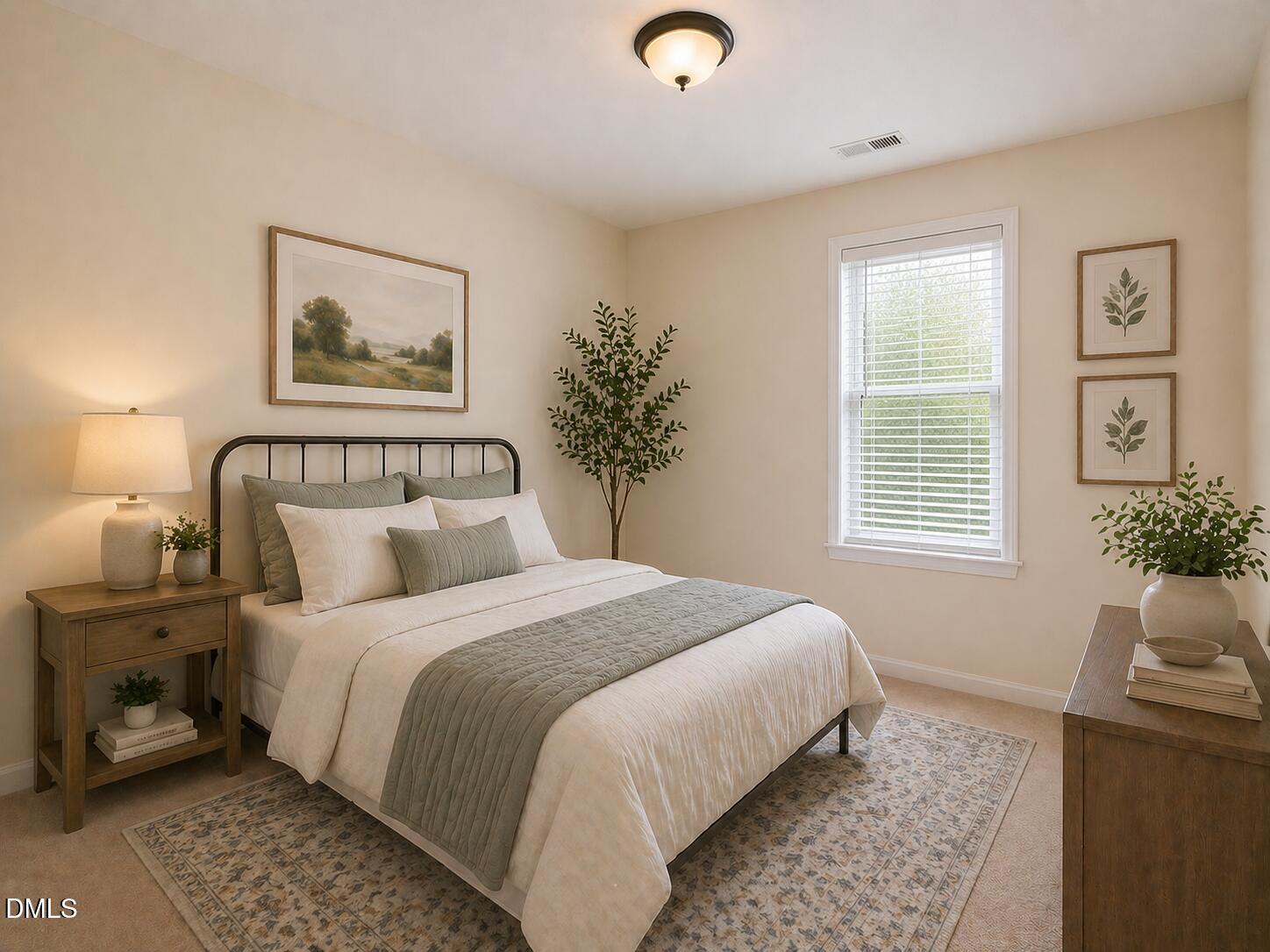 5539 Nur Lane Raleigh, NC 27606 - Photo 18 of 20 a bedroom with a bed and wooden floor