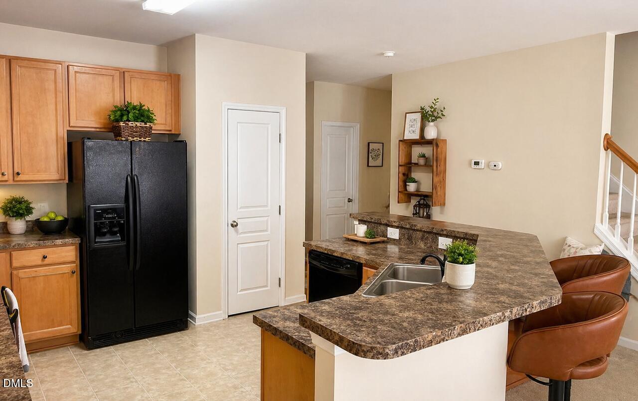 5539 Nur Lane Raleigh, NC 27606 - Photo 5 of 20 a kitchen with stainless steel appliances granite countertop a refrigerator a stove and a refrigerator