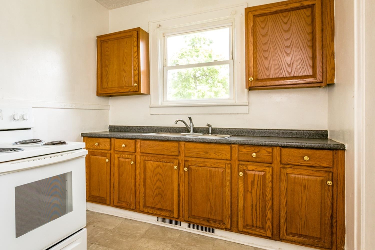 613 Alpha Street Waynesboro, VA 22980 - Photo 8 of 16 a kitchen with stainless steel appliances granite countertop white cabinets and a sink